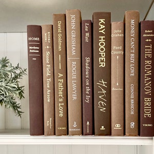 Brown book decor, fall color bookshelf staging books, brown toned books, bookshelf decor, table books, book stack, bookcase for fall