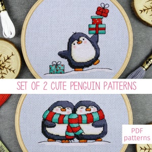 May include: Set of two cute penguin cross stitch patterns. One pattern features a penguin carrying a stack of presents. The other pattern features two penguins hugging each other, wearing a red and teal scarf.