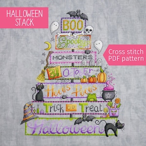 May include: A cross-stitch pattern with a Halloween theme, showing a stack with the words "Halloween Stack". The design includes ghosts, bats, pumpkins, and the phrases "Boo", "Spooky", "Monsters", "Hocus Pocus", "Trick or Treat", and "Halloween".