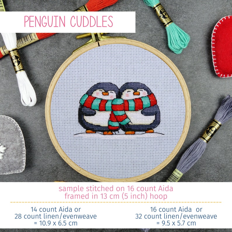 May include: Cross stitch pattern of two penguins wearing red and teal scarves, stitched on 16 count Aida fabric and framed in a 5 inch hoop. The finished piece measures 10.9 inches by 6.5 inches.