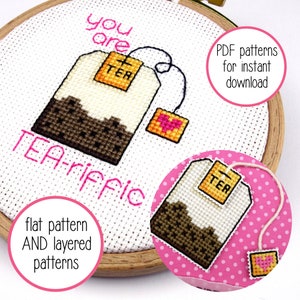 May include: A cross-stitch pattern featuring a tea bag with the text "you are TEA-riffic". The pattern is available as a PDF download and includes both flat and layered versions.