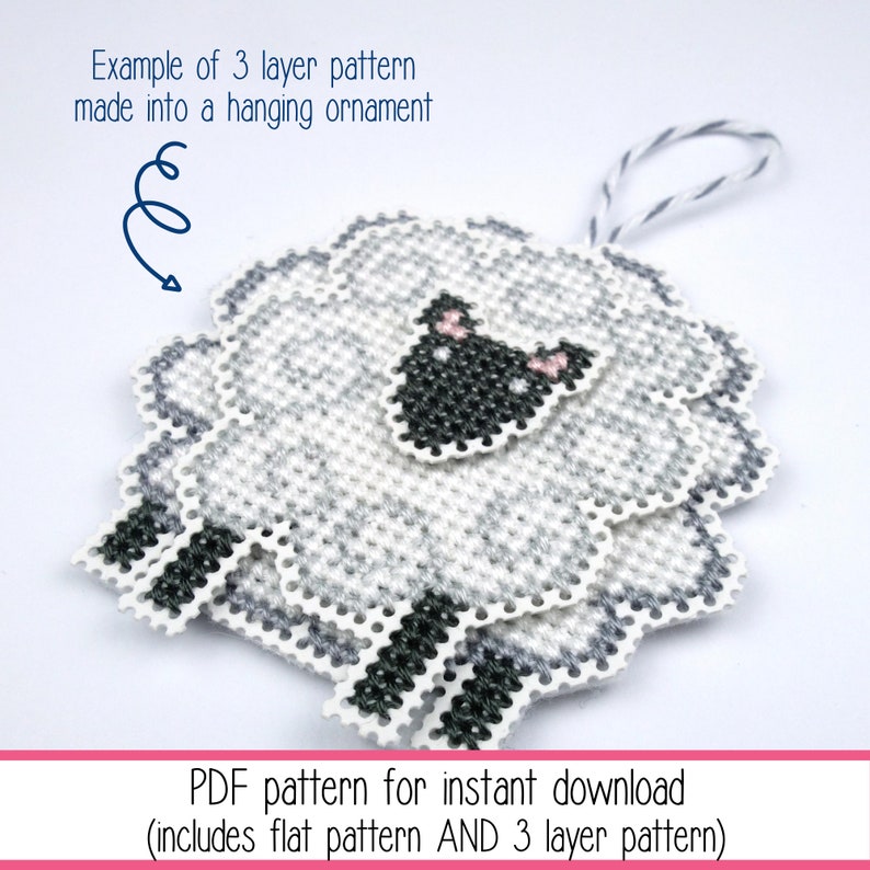 Cross stitch of a small stylised sheep stitched on perforated paper in 3 sections and layered together to create a hanging ornament with a twine loop. The listing is for the PDF cross stitch pattern.