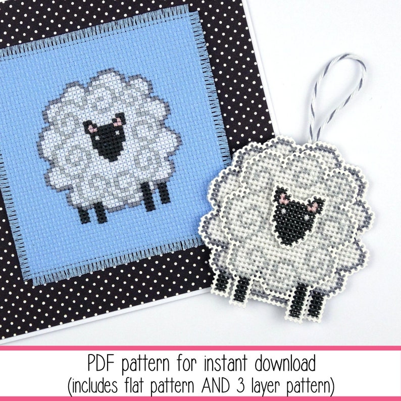 Cross stitch of a small stylised sheep stitched on blue Aida as a greeting card and also on perforated paper as a hanging ornament. The listing is for the PDF cross stitch pattern.