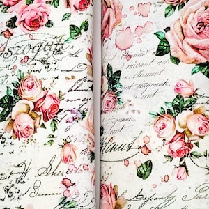 May include: Two rectangular cases with a floral rose design. The cases feature a white background with pink roses, green leaves, and handwritten script. The edges are black.