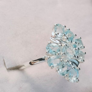 Ring - Topaz Skyblue Floral Crossover Ring (Size L) in Sterling Silver 1.500Ct.  FREE POSTAGE