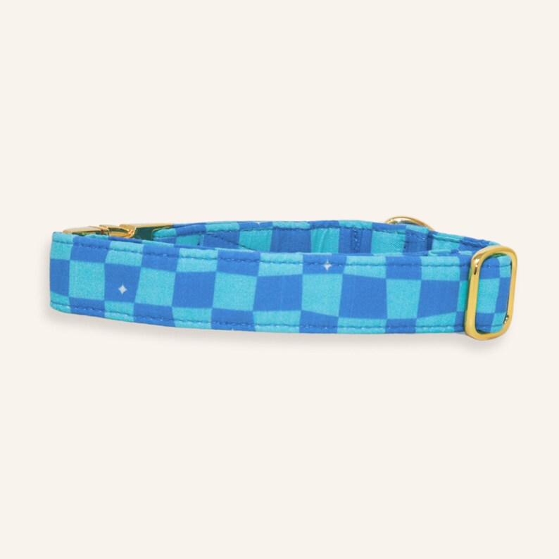 Blue checkered adjustable dog collar with durable gold hardware, handcrafted for everyday wear and matching pet accessories.
