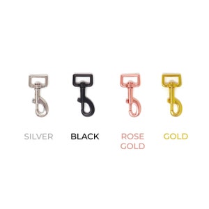 May include: Four metal clasps in different finishes: silver, black, rose gold, and gold.
