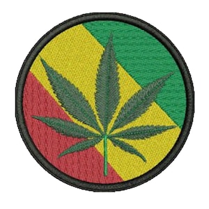May include: Embroidered patch featuring a green cannabis leaf at the center. The background is divided into red, yellow, and green sections, with a black border. The patch is round and has a textured appearance.