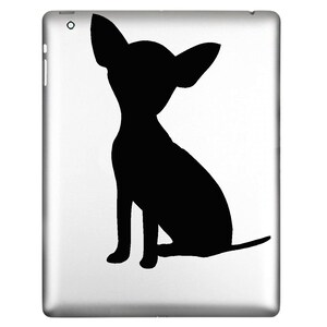 May include: A black silhouette of a Chihuahua dog is displayed on a silver tablet. The dog is sitting with its ears perked up and tail extended. The image is a simple, graphic design.