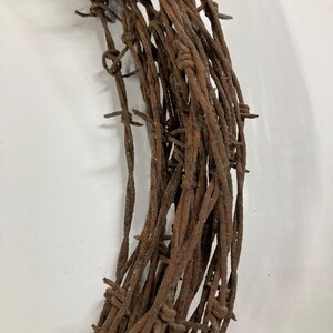 May include: A rustic wooden sign with the text "Welcome to our home" in white lettering. The sign features a distressed finish and a simple, inviting design, perfect for entryway decor.