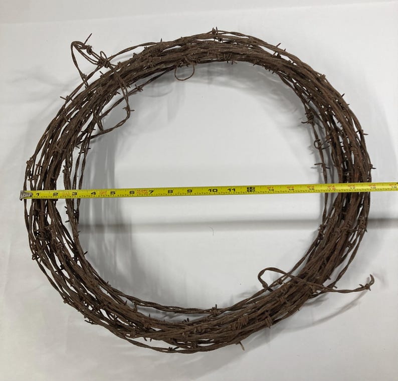 May include: A white ceramic mug with a black handle and the text "But First, Coffee" in a bold, black font. The mug is set against a neutral background, highlighting its simple design.