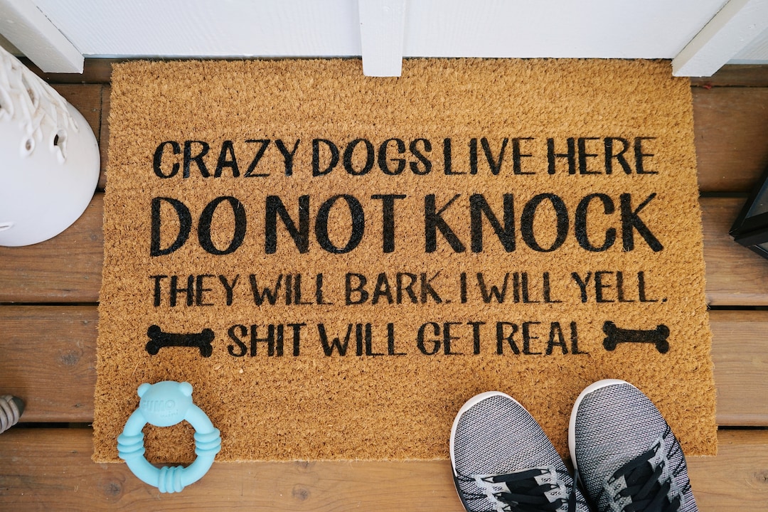 Crazy dogs live here clearance doormat