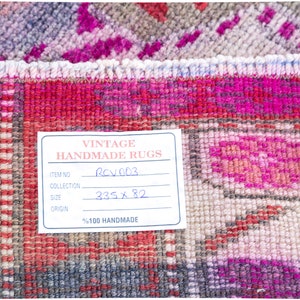 May include: A close-up of a vintage handmade rug tag with the text "Vintage Handmade Rugs", "Item No. RCV003", "Collection", "Size 335 x 82", and "Origin %100 Handmade".
