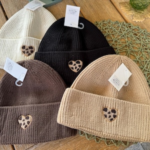 Cozy hat with Leo heart in different colors