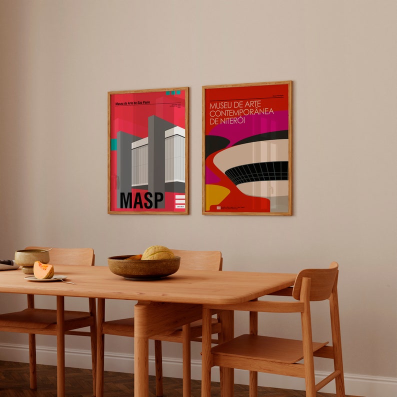 May include: Two framed posters of modern art museums in Brazil. The poster on the left is for the Museu de Arte de S&atilde;o Paulo Assis Chateaubriand (MASP) and features a red and gray building. The poster on the right is for the Museu de Arte Contempor&acirc;nea de Niter&oacute;i and features a flying saucer-shaped building with a red, yellow, and pink background.