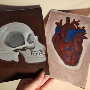Pinturas de cartón reciclado: Corazón y calavera