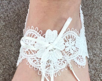 Barefoot Sandal. Off white, adjustable, boxed