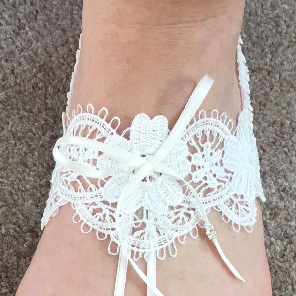 Barefoot Sandal. Off white, adjustable, boxed