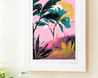May include: A framed art print featuring a desert landscape with a pink sky and a yellow sun. The artwork includes stylized trees, cacti, and foliage in shades of teal, yellow, and dark green. The print is in a white frame.