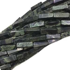 May include: A strand of dark green and black gemstone beads, each bead is a rectangular prism with a smooth, polished finish.