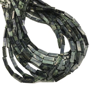 May include: A strand of dark green and black gemstone beads, each bead is a rectangular prism with a smooth, polished finish.