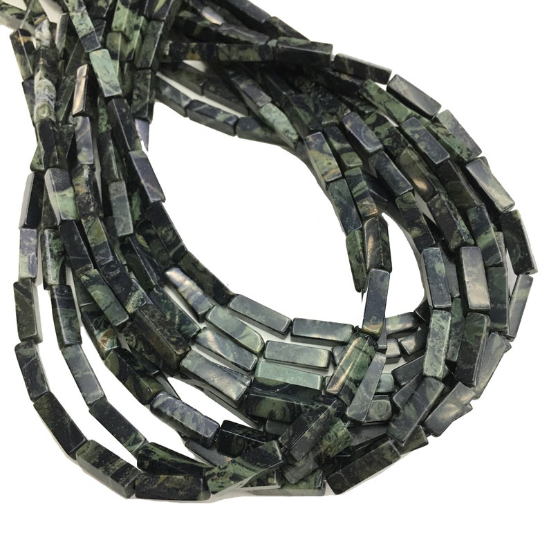 May include: A strand of dark green and black gemstone beads, each bead is a rectangular prism with a smooth, polished finish.