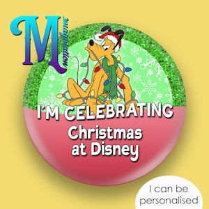 May include: A circular badge featuring Pluto, a Disney cartoon dog, wearing a Santa hat and Christmas lights. Text reads "I'M CELEBRATING Christmas at Disney". The badge has a red and green design with a yellow background.