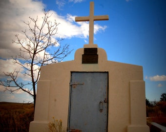 Original stock art photo..cross in a NM cemetary.."Such a precious son it is the one that shines after a cold harsh rain k. A. Tucker author