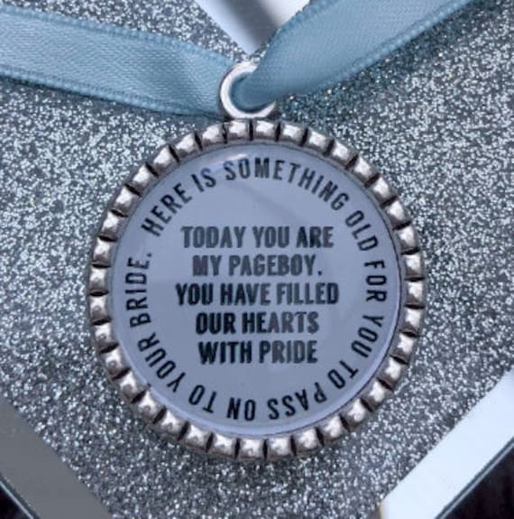Page boy keepsake something old for his bride to be something blue beautiful keep sake blue ribbon charm pendant. thank you.