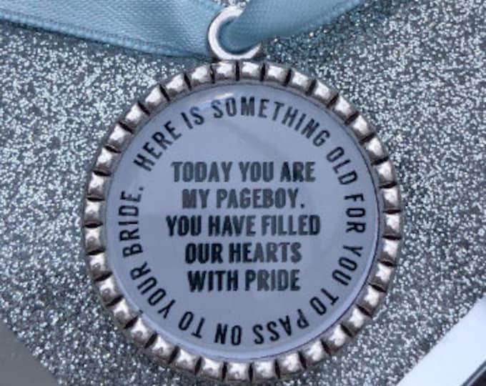 Page boy keepsake something old for his bride to be something blue beautiful keep sake blue ribbon charm pendant. thank you.