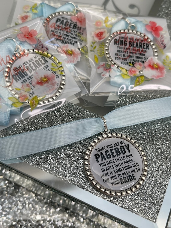 Page boy keepsake something old for his bride to be something blue beautiful keep sake blue ribbon charm pendant. thank you.