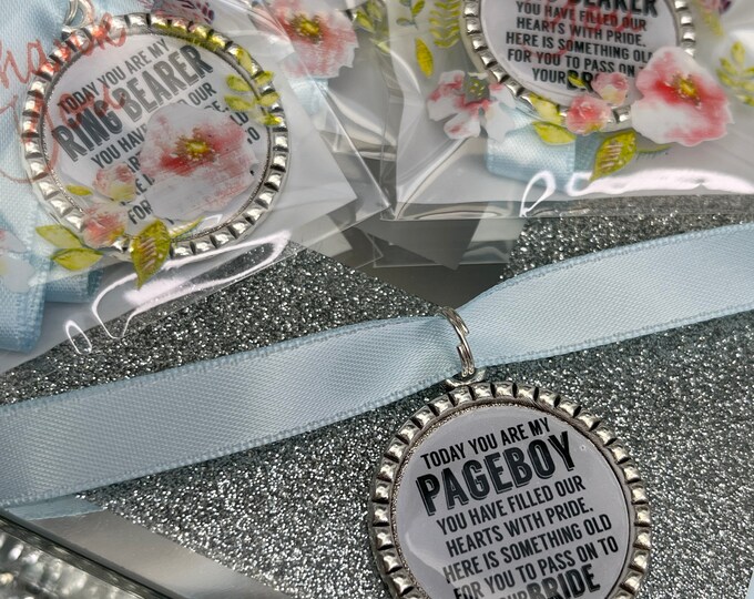 Page boy keepsake something old for his bride to be something blue beautiful keep sake blue ribbon charm pendant. thank you.