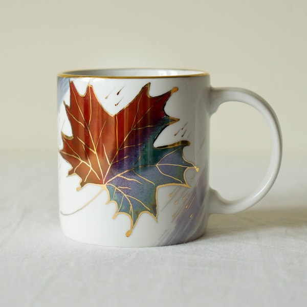 Hand painted autumn-themed porcelain tea cup with red and blue maple leaf. Extravagant big tea mug with gold accents for cozy tea lover.
