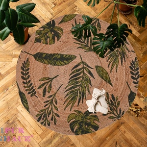 Floral Jute Rug - Artistic Calm Experience the artistry of mindful living with our 3 ft round jute rug, adorned with peaceful mandalas.