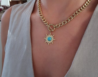 Thick gold stainless steel chain collar t-clasp necklace with a turquoise colour howlite gemstone sun pendant, chunky rock modern jewellery