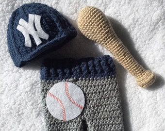 Baby, New York Yankees hat and pant set with baseball appliqué. Baseball bat optional.