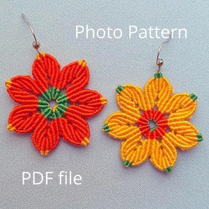 May include: A pair of handmade macrame earrings with a flower design. The earrings are made with orange, yellow, and green cord and have silver ear wires. The earrings are shown against a light blue background. "Photo Pattern" and "PDF file" are written in black text on the image.