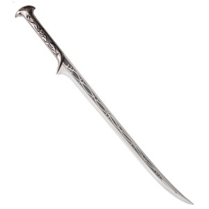 May include: A silver sword with a detailed, intricate design on the blade and handle. The sword has a pointed tip and a curved handle.