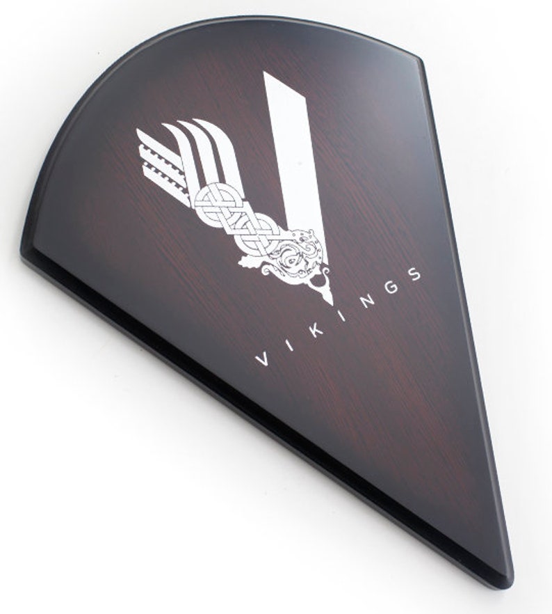 May include: A dark brown wooden shield with a white Viking logo and the word "VIKINGS" in white lettering.