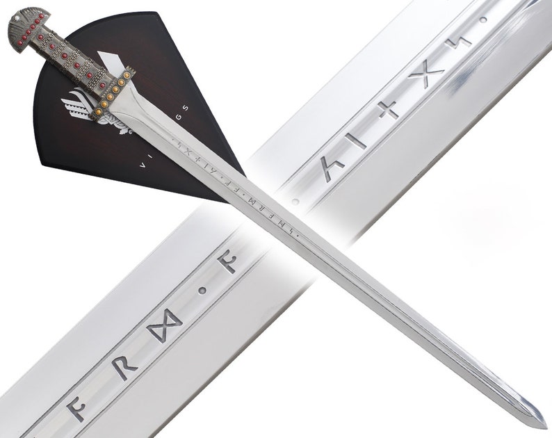 May include: A silver Viking sword with a black and red scabbard. The sword has runes engraved on the blade and the scabbard has a Viking shield design. The sword is displayed on a white background.