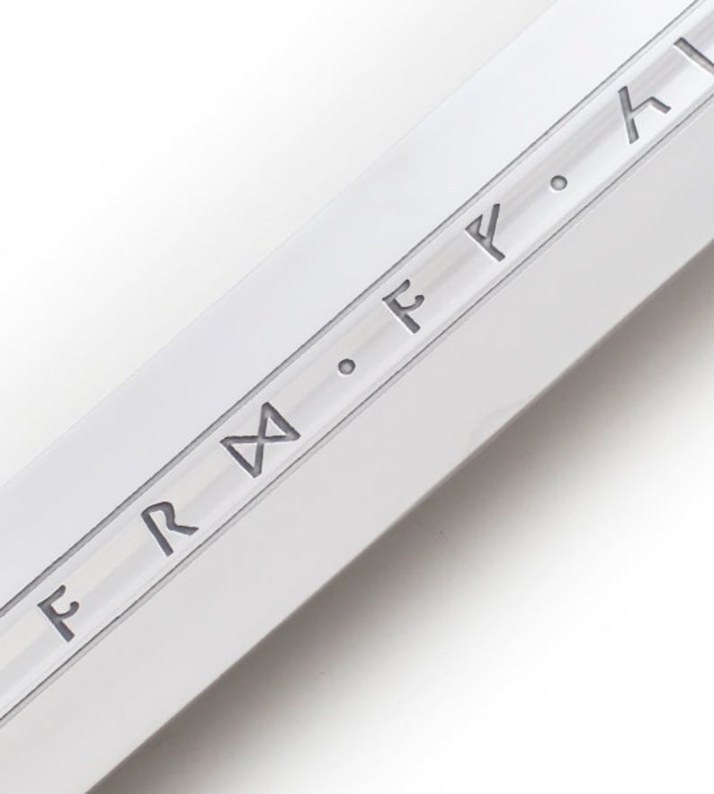 May include: Close-up of a silver blade with the inscription "F.R.M. F. F. H" etched into the surface.