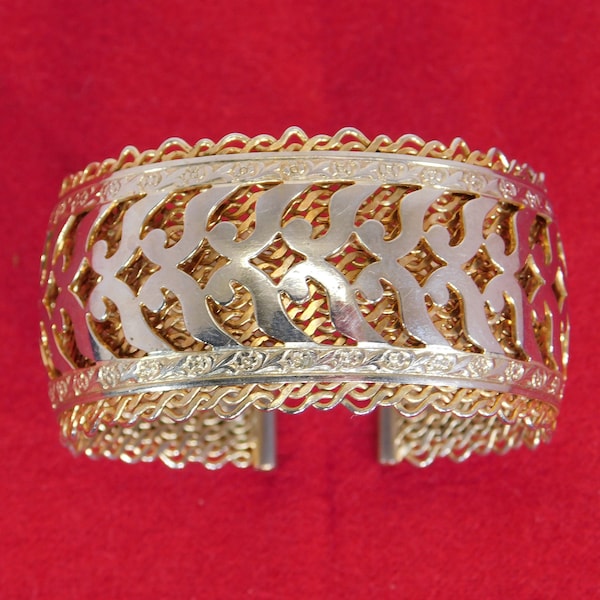 Volupte  cuff bracelet  mesh with scroll and flower design on top gold and silver tone
