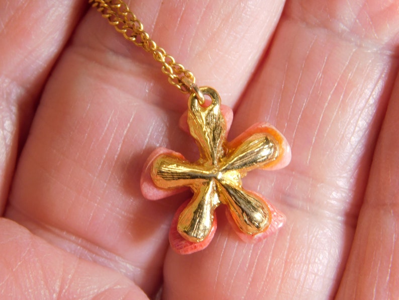 Gold fill chain signed arrow in circle with pink stone petal flower pendant has tiny faux pearl in center