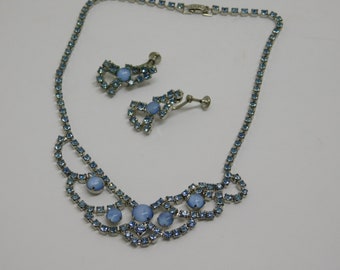 Necklace and screw back earring set with prong set rhinestones and cabochons in pastel blue