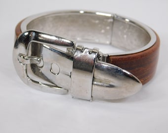 Bracelet in style of belt with buckle clasp silver tone with plastic