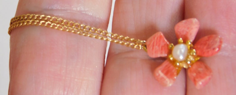 Gold fill chain signed arrow in circle with pink stone petal flower pendant has tiny faux pearl in center