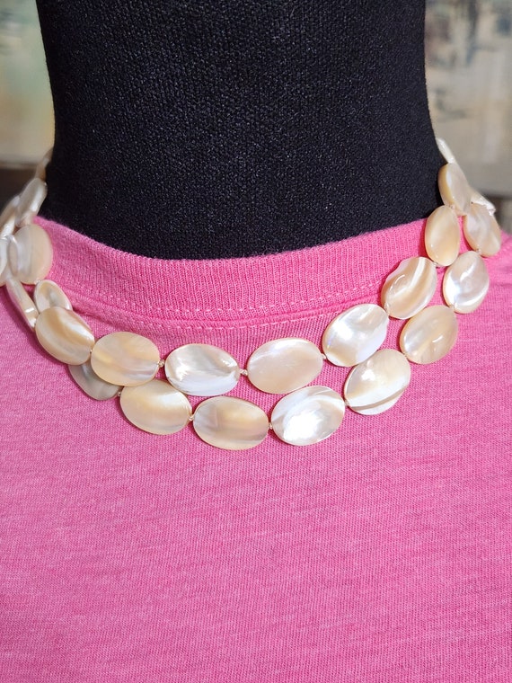 Double mother of pearl necklace on string tied at 