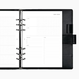 May include: Black leather planner open to a weekly spread for January 2026. The planner features a grid layout for each day, with sections for priorities, to-do lists, and notes. The binding is silver.
