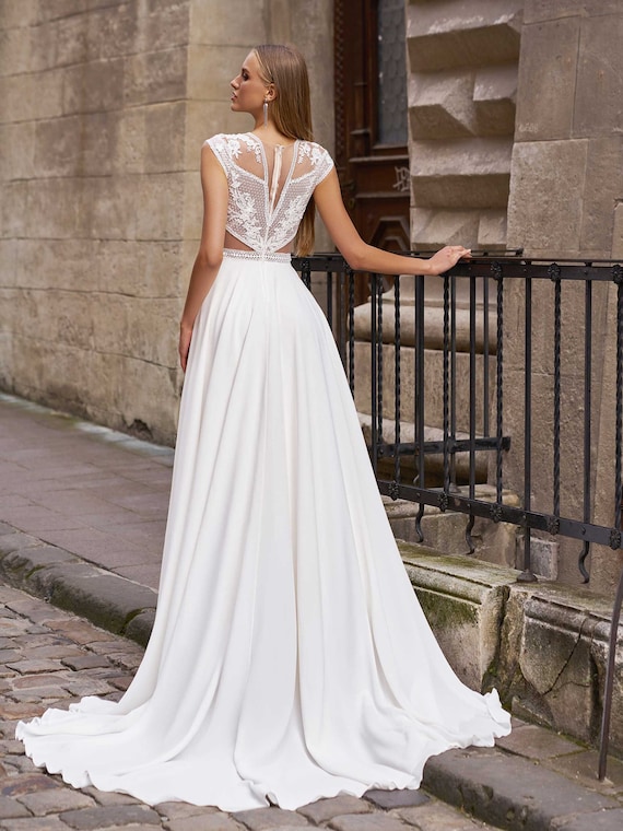 A boho spaghetti strap wedding dress with light flowing skirt.  #spaghettistrapwe… | Chic wedding dresses, Maggie sottero wedding dresses,  Floral bridesmaid dresses