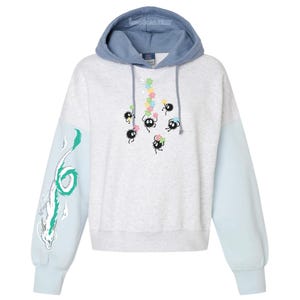 May include: A light gray hoodie with a blue hood and light blue sleeves. The hoodie features a design of black soot sprites with colorful flowers and a white and green dragon on the left sleeve.